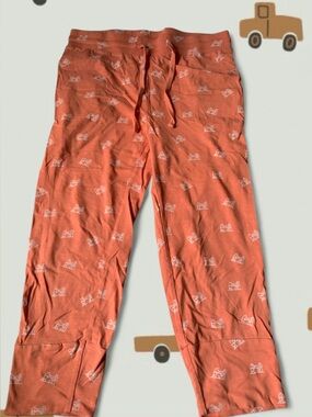 Kate Quinn Orange Joggers with white Drums